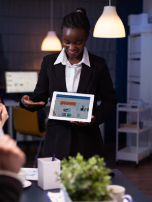 entrepreneur-woman-overworking-company-office-meeting-room-explaining-management-strategy-using-tablet KEYWORD RESEARCH SERVICE
